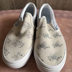 Vans Slip-On Sneakers in Cream and Dusty Blue with Angel & Skeleton Print