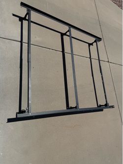 Heavy-duty steel bed frame designed to support a mattress without needing a box spring or can be used with box spring.