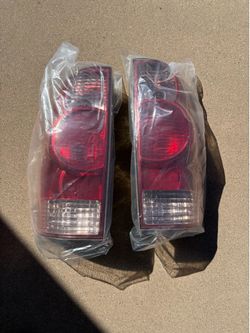 Used Tacoma tail lights covers.