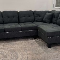 Brand new Ash black tweed velvet like sectional sofa with 2 accent pillows.