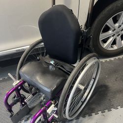 A TRAVISMEDICAL Wheel chair for small, Thin person or Children.