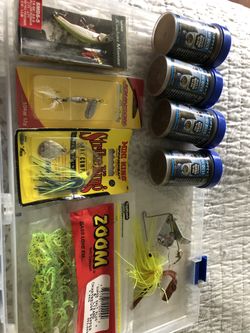 Five brand new fishing Lewers and four bottles of hatchery dust.