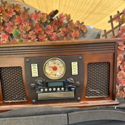 This is a Victrola Navigator 8-in-1 Classic Bluetooth Record Player. 