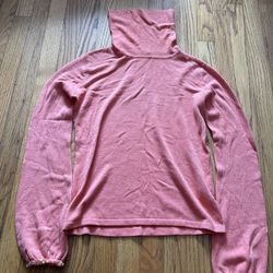 This is a coral orange (or pinkish orange) high-necked knitted sweater. • Style: Turtleneck knitted sweater with a gathered neckline. • Size: L size (