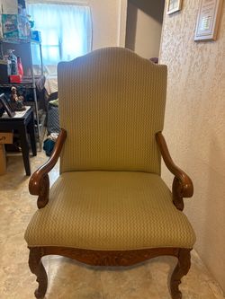 Traditional Upholstered Armchair with Carved Wood
