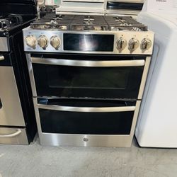 GE stainless steel double oven range, 30 inches wide, with a receipt for a 60-day warranty.