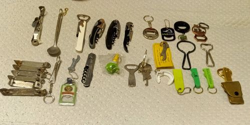 25 Bottle Openers And 9 Can Openers And 1 Capp