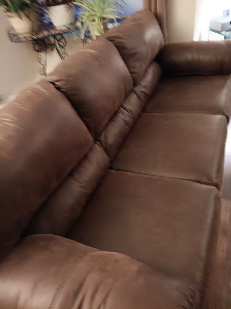 Ashley Brown Couch with oversized Recliner and Ottoman