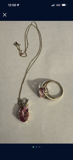 Woman’s Gold ring with Matching necklace and charm asking $500 Obo