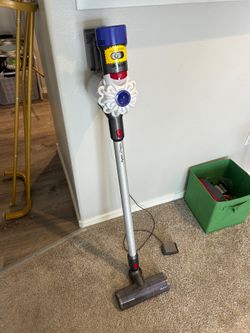 Cordless Dyson Vacuum with attachments, filters, and wall mount
