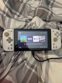 Nintedo switch/3 Game chips/ Case/Bigger controllers/ and two spare controllers