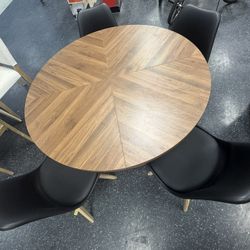 Brown Wood Table With 4 Black Faux Leather Seats