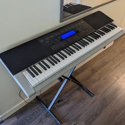 Casio Pseudo Weighted 76-Key Electronic Piano Keyboard  - 76 Touch-Sensitive keys, 600 tones, 180 rhythms, Midi + Stand/Power Cord (WK-220 MSRP $499)