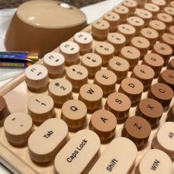 brown wireless keyboard and mouse 