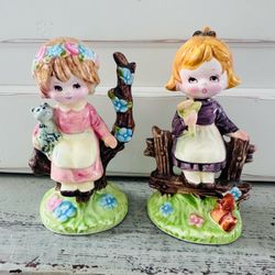 Set of 2 vintage Napco flower girl ceramic figurines approx 4 1/2” tall.  Great condition No chips or cracks no paint loss