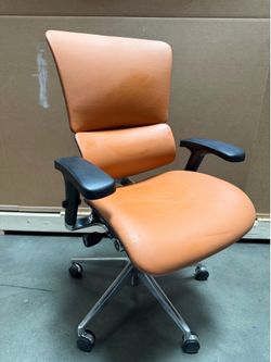 Brand new X chair out of the box in camel leather! Never used!