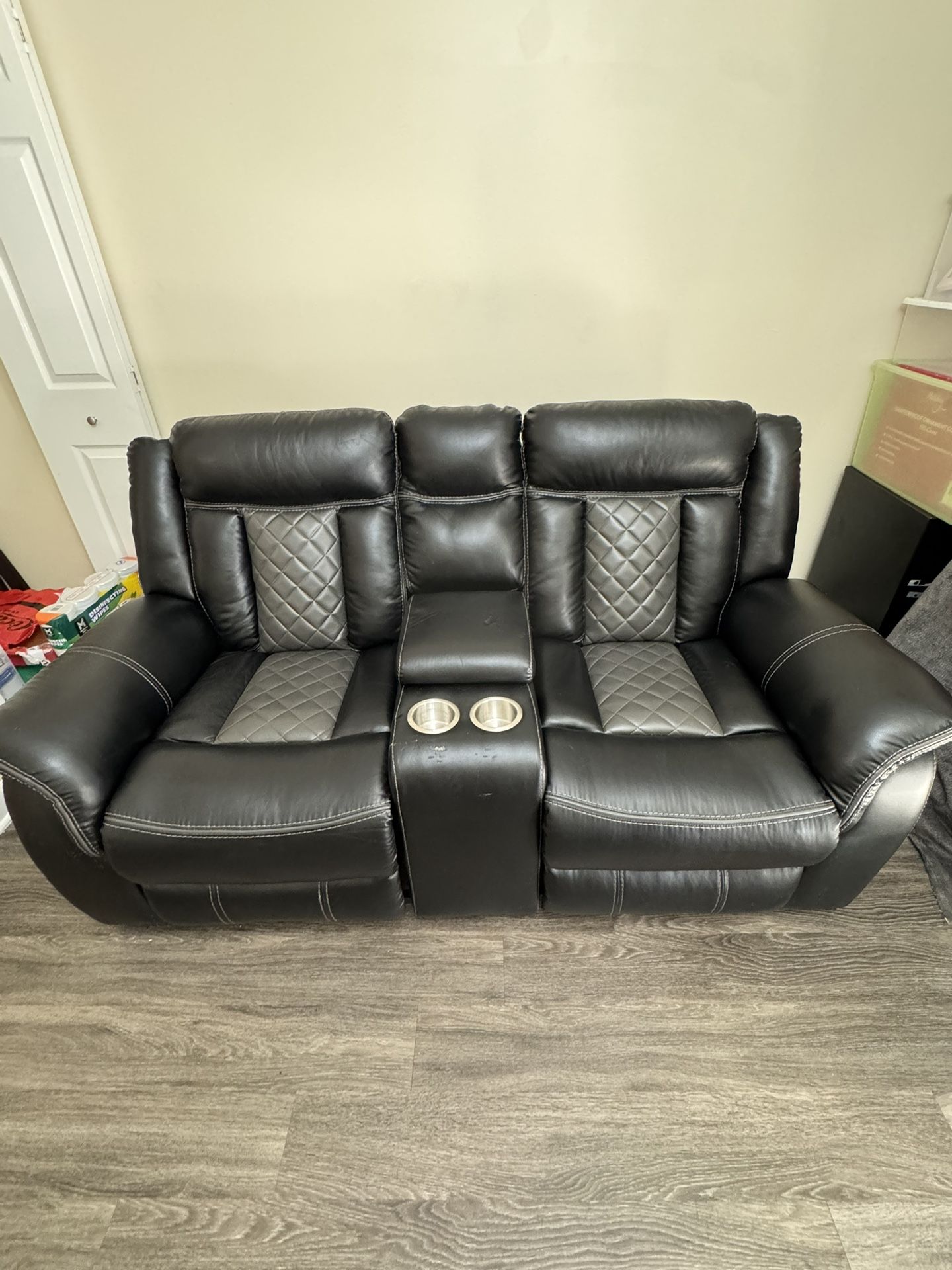 Double leather reclining sofa with cup holder