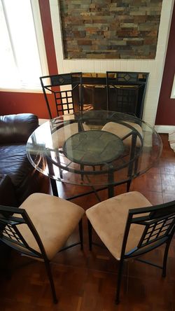 Glass table and chairs with slate tiles
