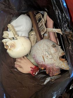Assorted vintage spirit Halloween heads and props zombies and skeletons
