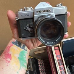 Fujica ST701 35mm film SLR camera. With Hoya 49mm UV(0) filter.lens