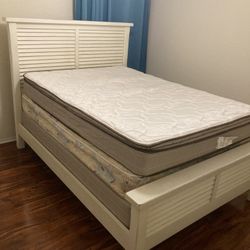 White solid wood full size bed frame, 1 box spring, 2 mattresses, and white solid wood dresser