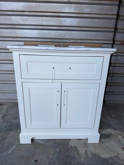 Home Decorators Collection Doveton 30” white bathroom vanity cabinet.