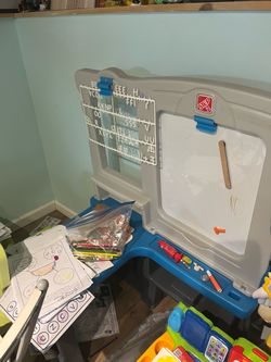 This is a white board with a desk attached