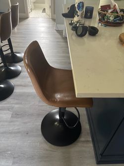 Adjustable stools with foot pedal