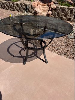 Round Smoked Glass Dining Table with Black Metal Base