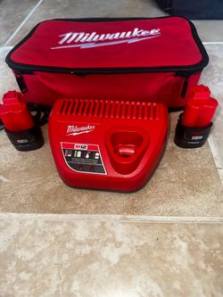 2    BATTERIES .   Milwaukee M12 12-Volt Lithium-Ion Starter Kit with Two 1.5Ah Battery Packs and Charger