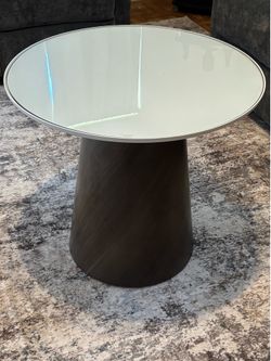Rotating   Coffee table with glass top  or best offer