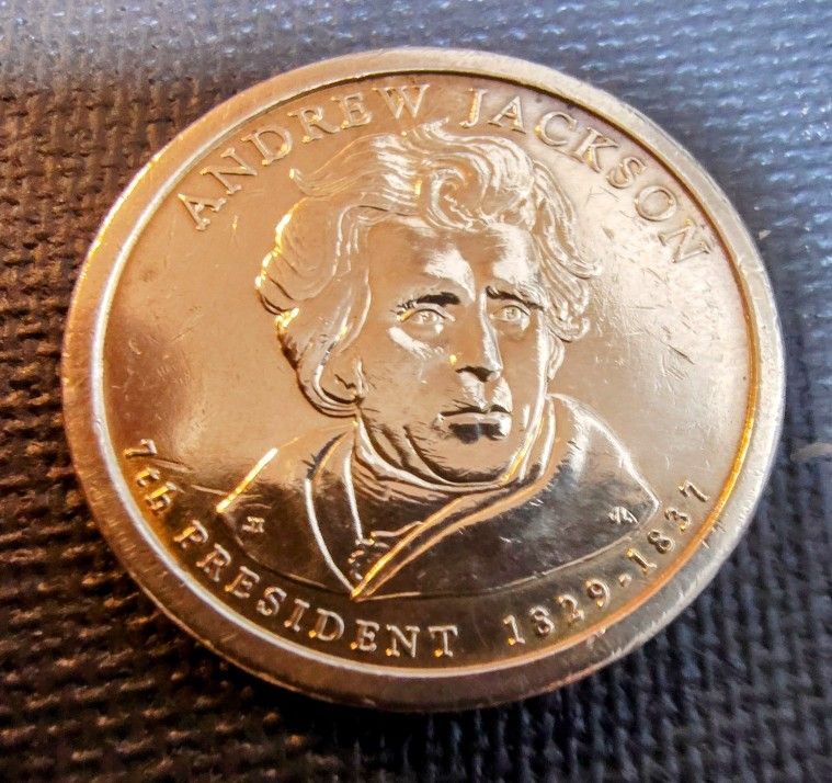 2- Presidential Gold Tone Coins Andrew Jackson & John Adams In Good Circulated Condition.