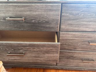 Dark Gray Wood Grain Dresser with Metal Handles