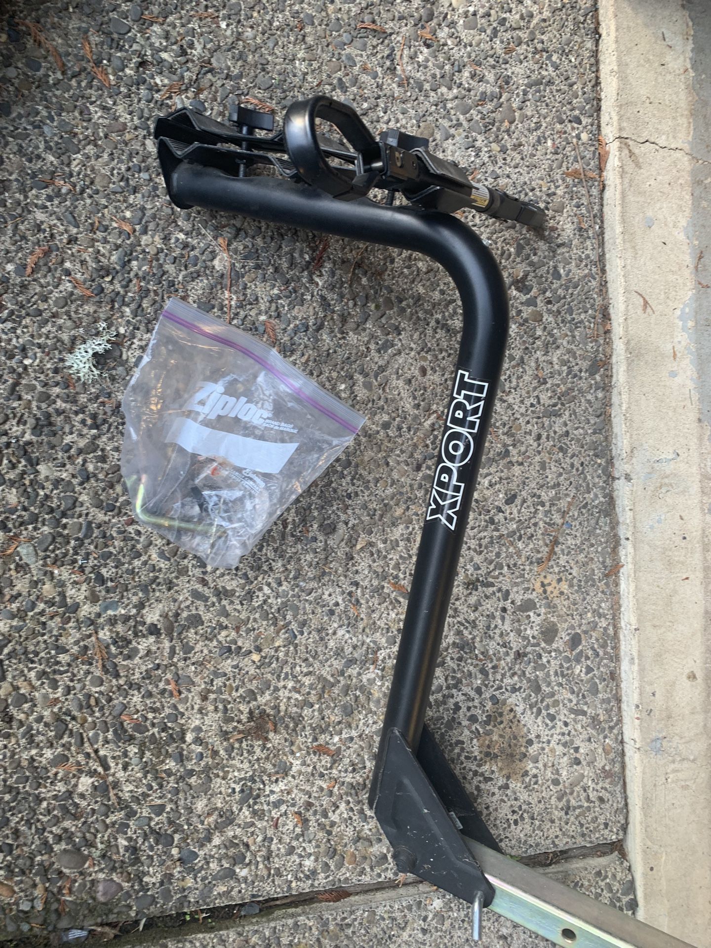 U part of a hitch-mounted bike rack, branded XPORT — specifically the main mast + frame clamp assembly, not a complete rack.