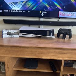 PS5 W/ 2 Controllers, a Charging Station and 5 Games