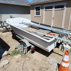 Double Hull Boat, Engine, Paddles And A Couple Life Vest