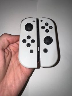 White Nintendo switch controllers slight use