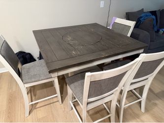 Dining room table with 4 chairs and a bench