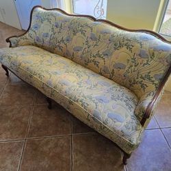 Antique sofa with floral upholstery pattern