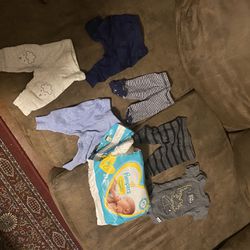 Preemie Clothes and pack opened preemie diapers with 2 missing from pack 