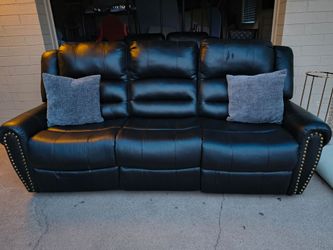 Sofa and loveseat in black faux leather