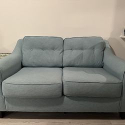 Blue Loveseat And Ottoman/ Table 