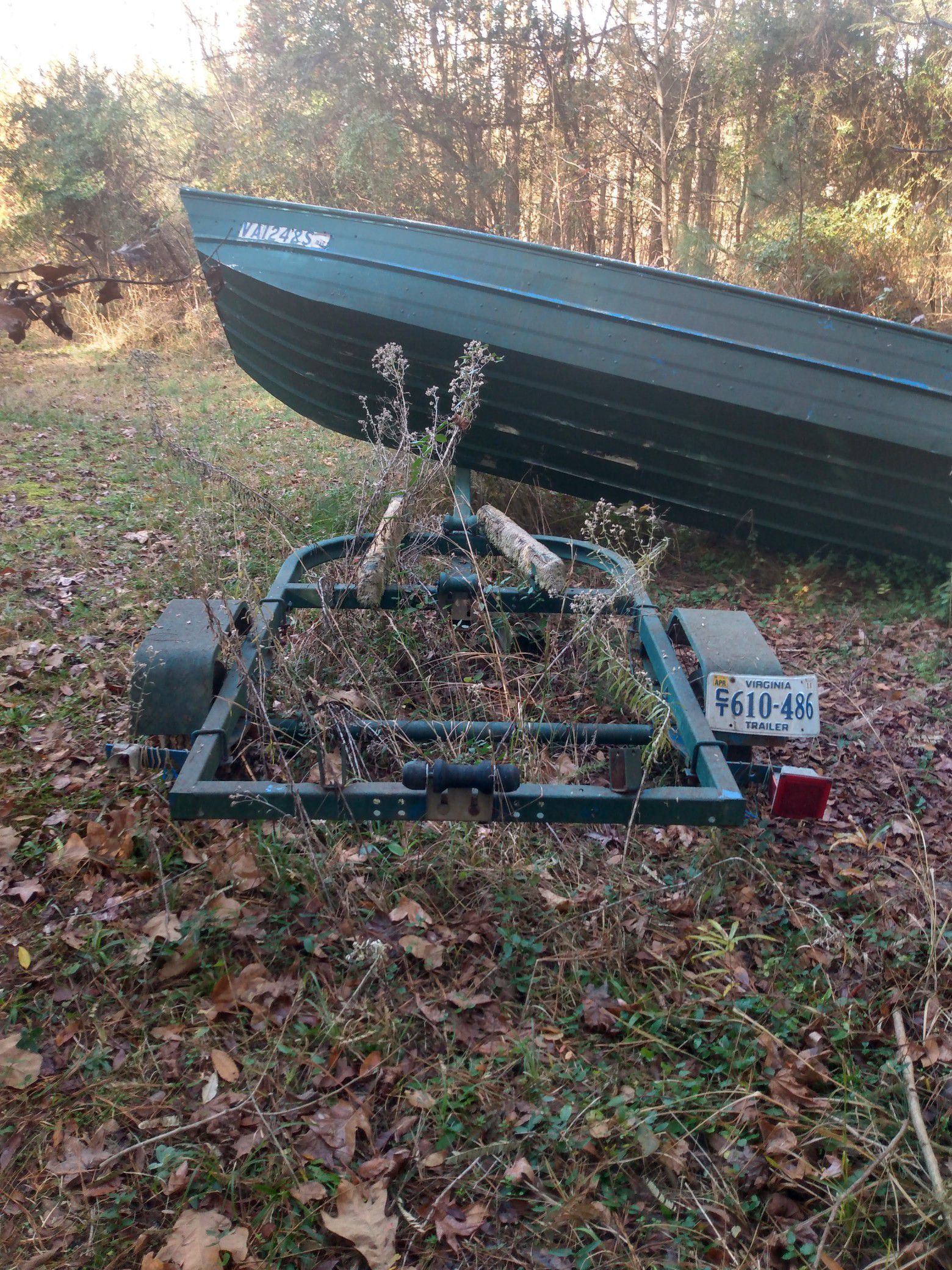 14 foot jon boat trailer (with boat if you want it) WITH CLEAN TITLE.