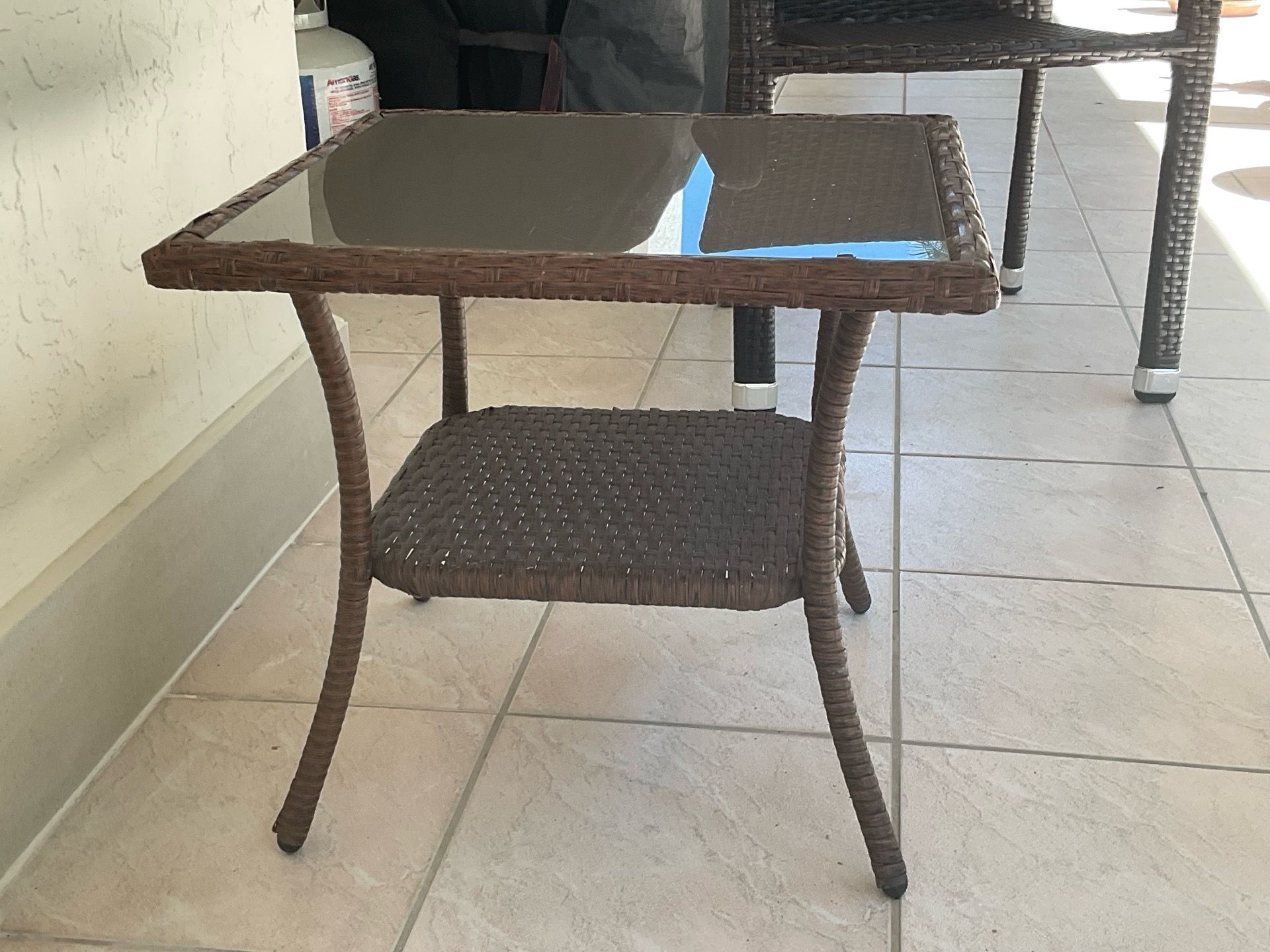 Outdoor plastic chairs plus outdoor table.