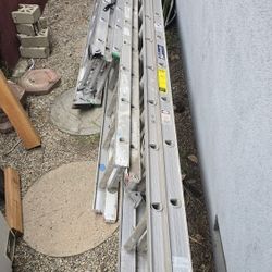 Lean To ladders. 28ft Louisville Aluminum, 18ft Werner And A 22ft