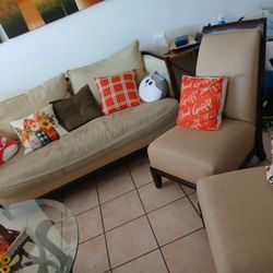 Couch, Cushioned Chairs, Pillows And Table