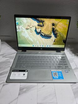 HP Pavilion x360 laptop. Has a 360-degree hinge for different modes. Features Intel Core i5 8th Gen processor. Keyboard is backlit. Audio is B&O tuned