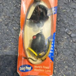 A vintage Snag Proof Racket Attack fishing lure