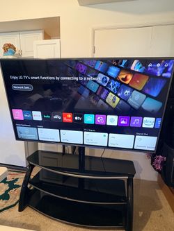 75” LG 4K UHD Smart TV (Model 75UN8570AUD) in excellent working condition. Includes black tempered glass 3-tier TV stand. Great picture quality with b
