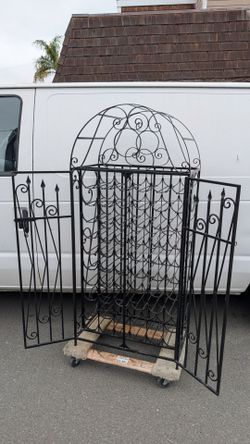Custom wrought iron wine rack shelf enclosure lockable cage bottle display case tower Spanish mission vintage style
